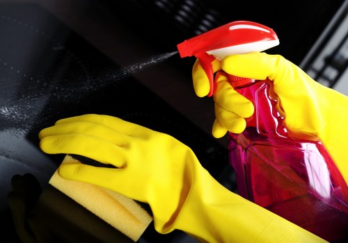 Domestic cleaner working in a Wembley kitchen and living area